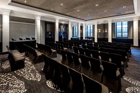 Modern meeting room with black chairs for corporate events at The Edwardian Manchester. - Banner
