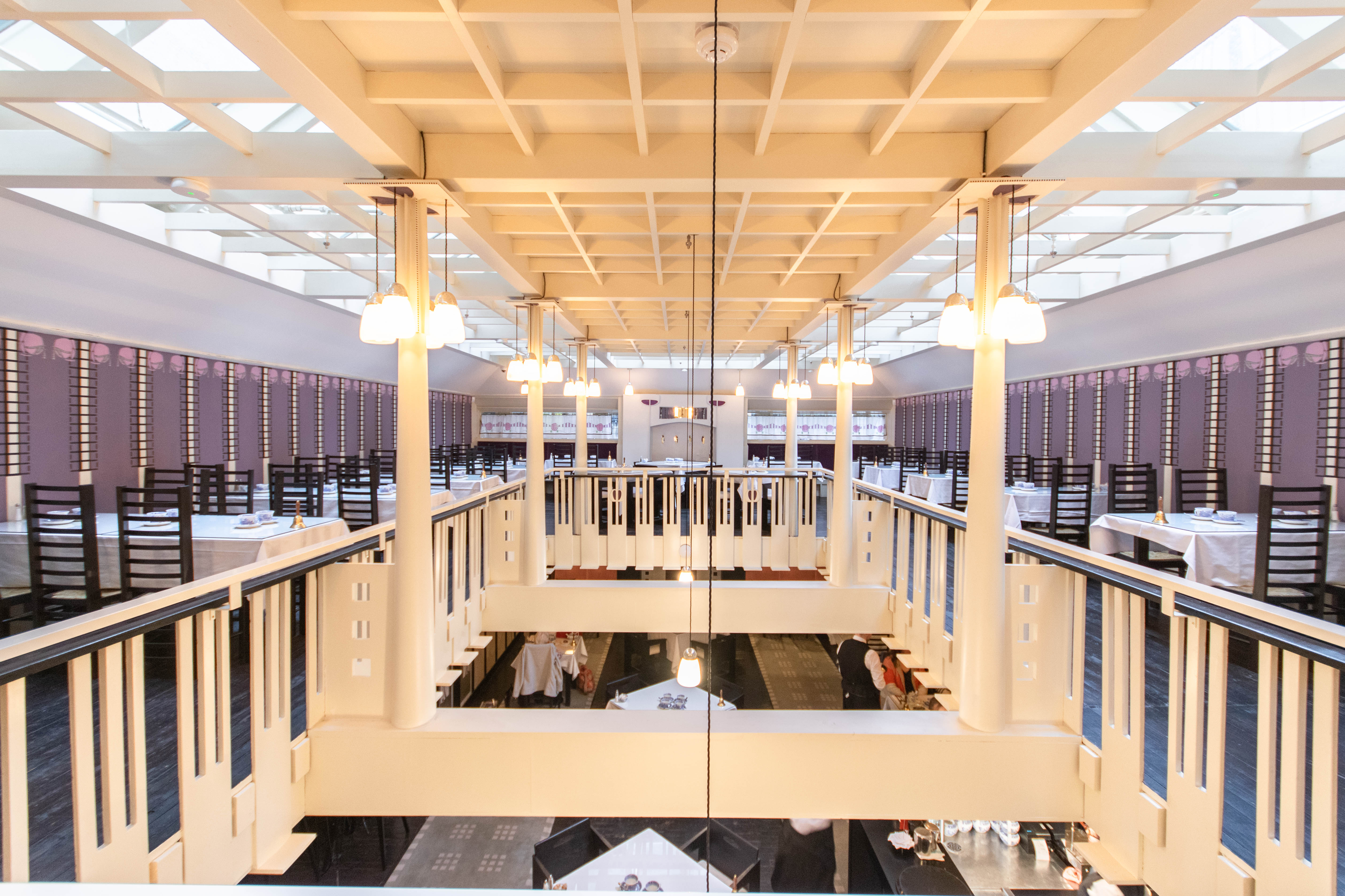 Spacious event venue with high ceilings and balcony at Mackintosh at the Willow. - Banner