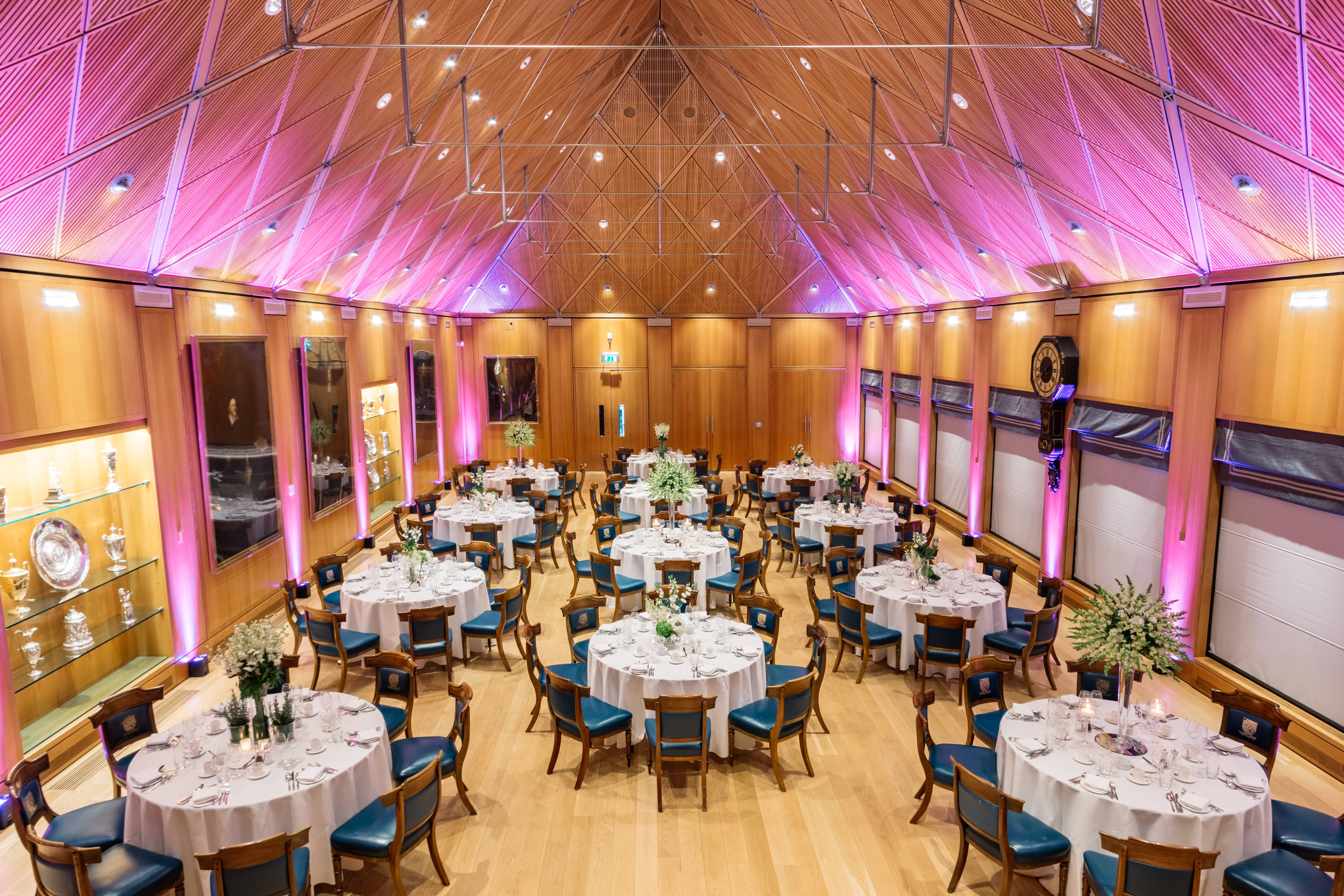 Elegant banquet hall with floral centerpieces, ideal for weddings and corporate events.