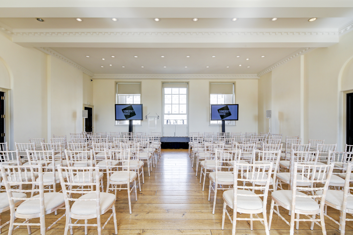 Elegant event space with white chairs at Somerset House for conferences and seminars.