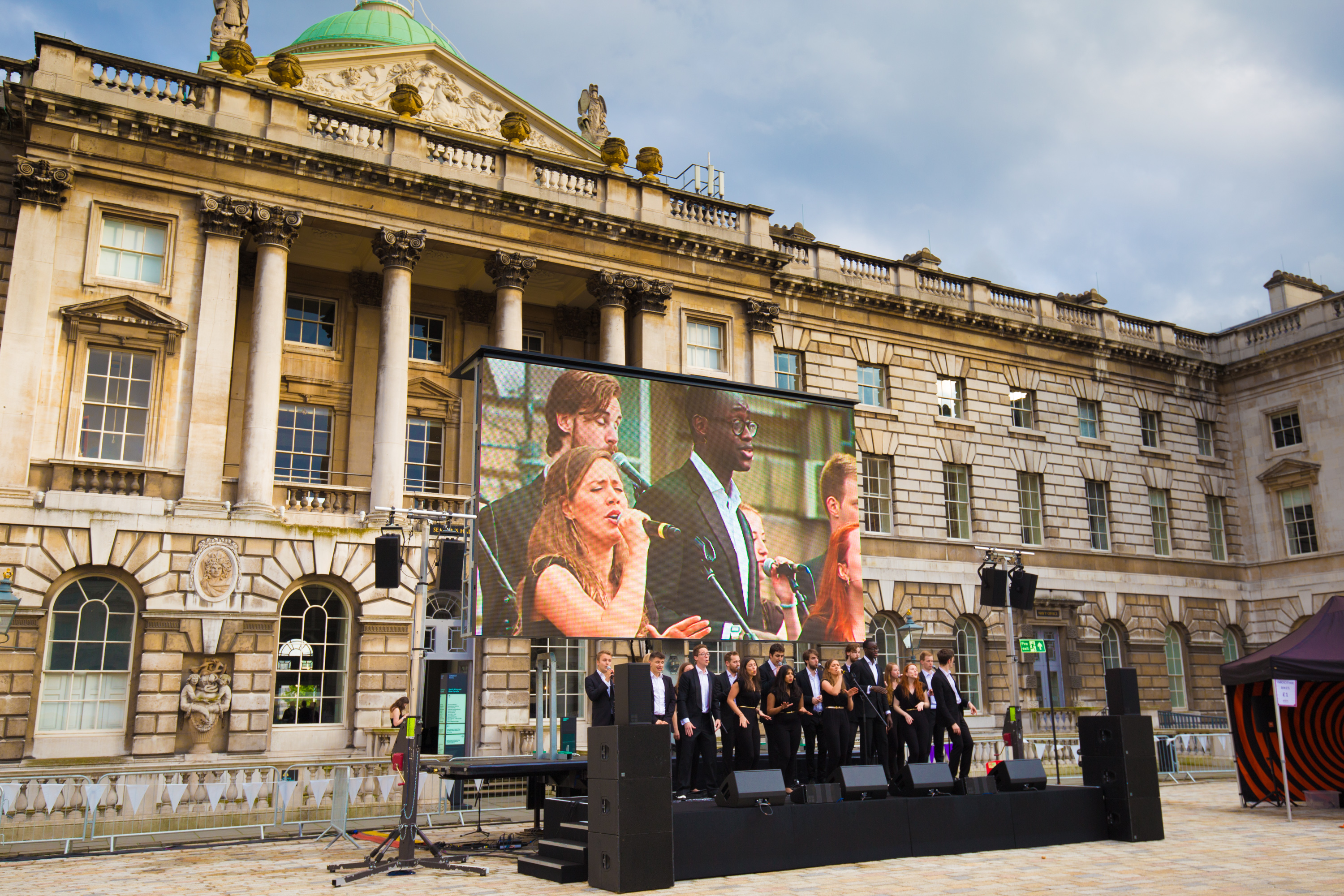 Edmond J. Safra Fountain Court event setup with large screen for corporate presentations.