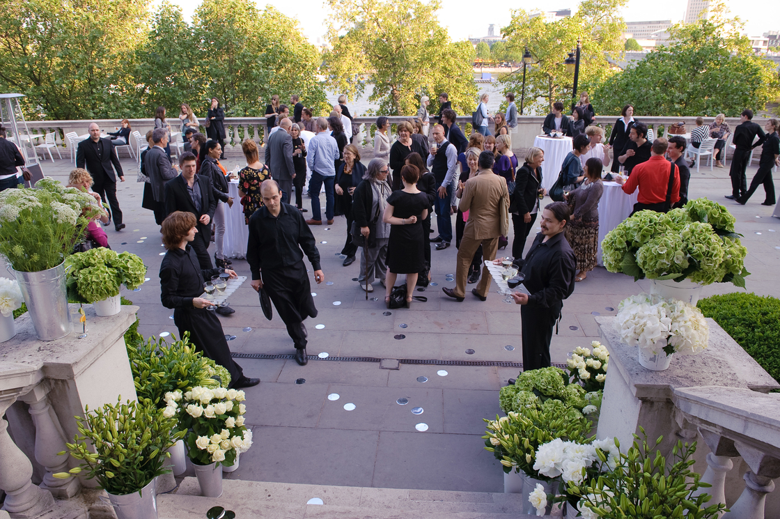 Vibrant outdoor event at Somerset House with elegant tables and floral arrangements.