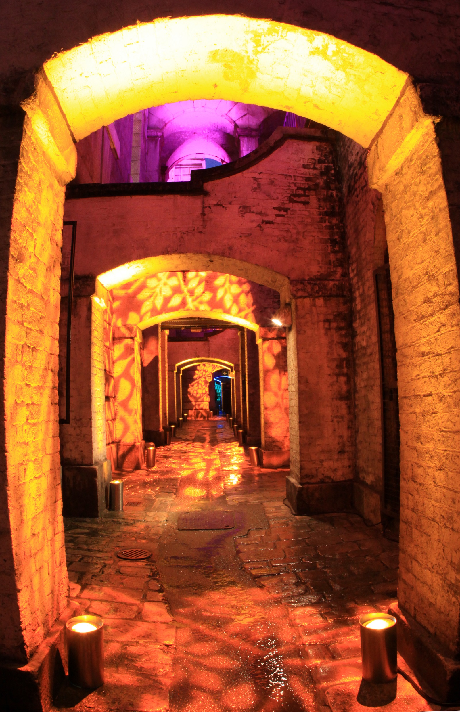 Lightwells and Deadhouse corridor at Somerset House, warm lighting for events.
