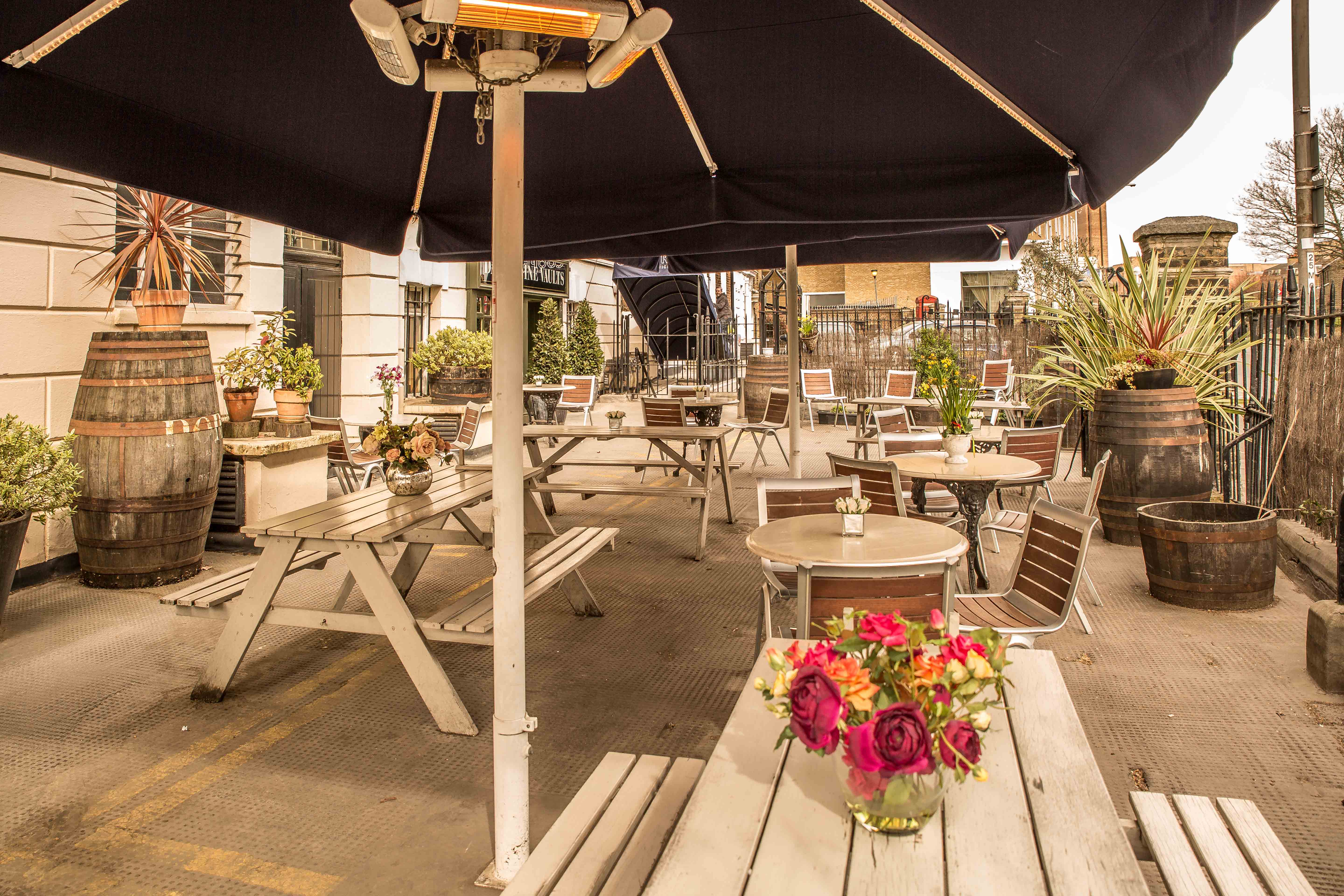Charming outdoor venue with picnic tables for casual meetings and events in Davy's Wine Vaults.