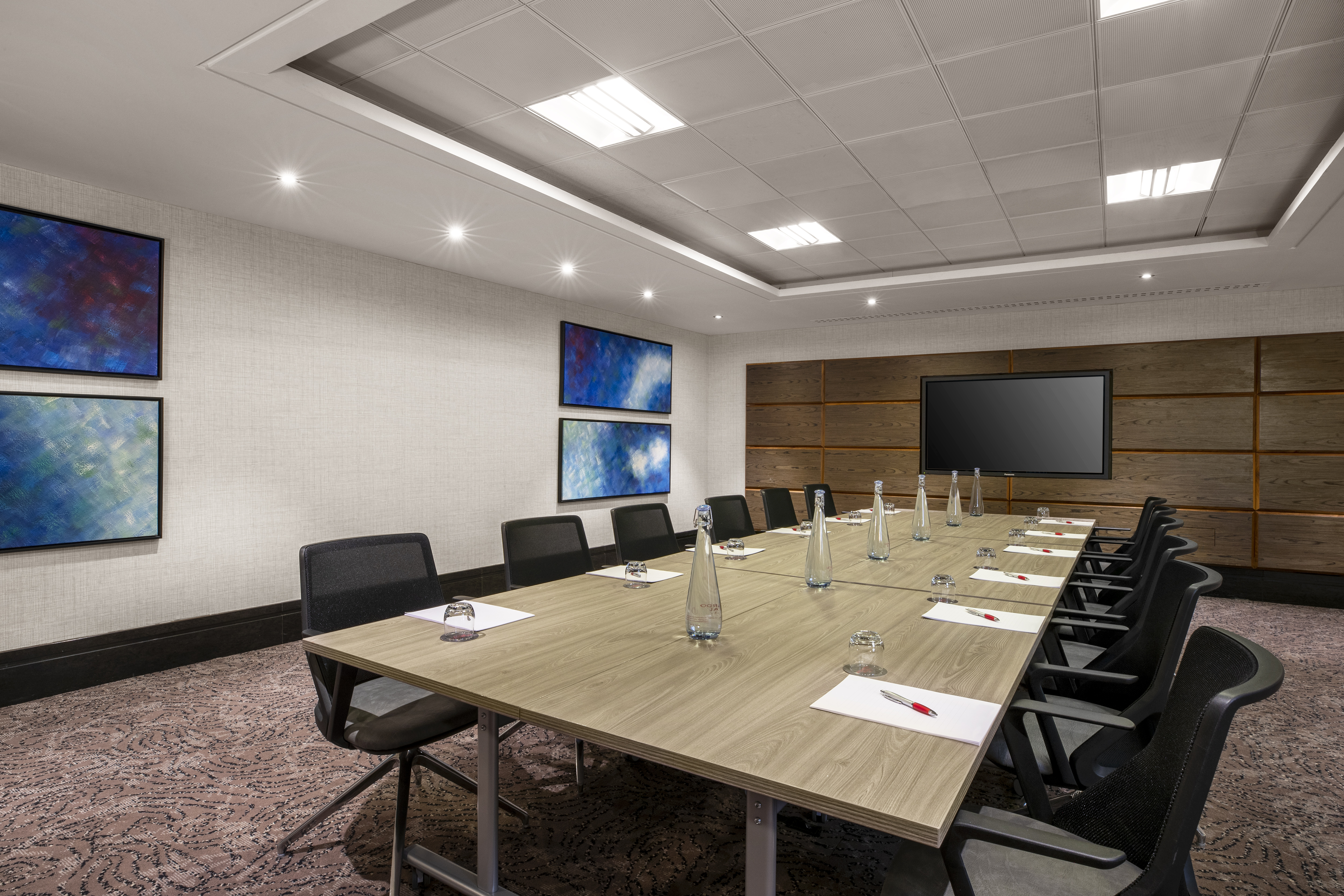 Modern conference room in Pepys Suite, Leonardo Royal Hotel London for meetings and presentations.