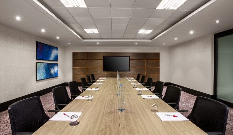 Modern conference room in Pepys Suite, Leonardo Royal Hotel London St. Pauls, ideal for meetings.