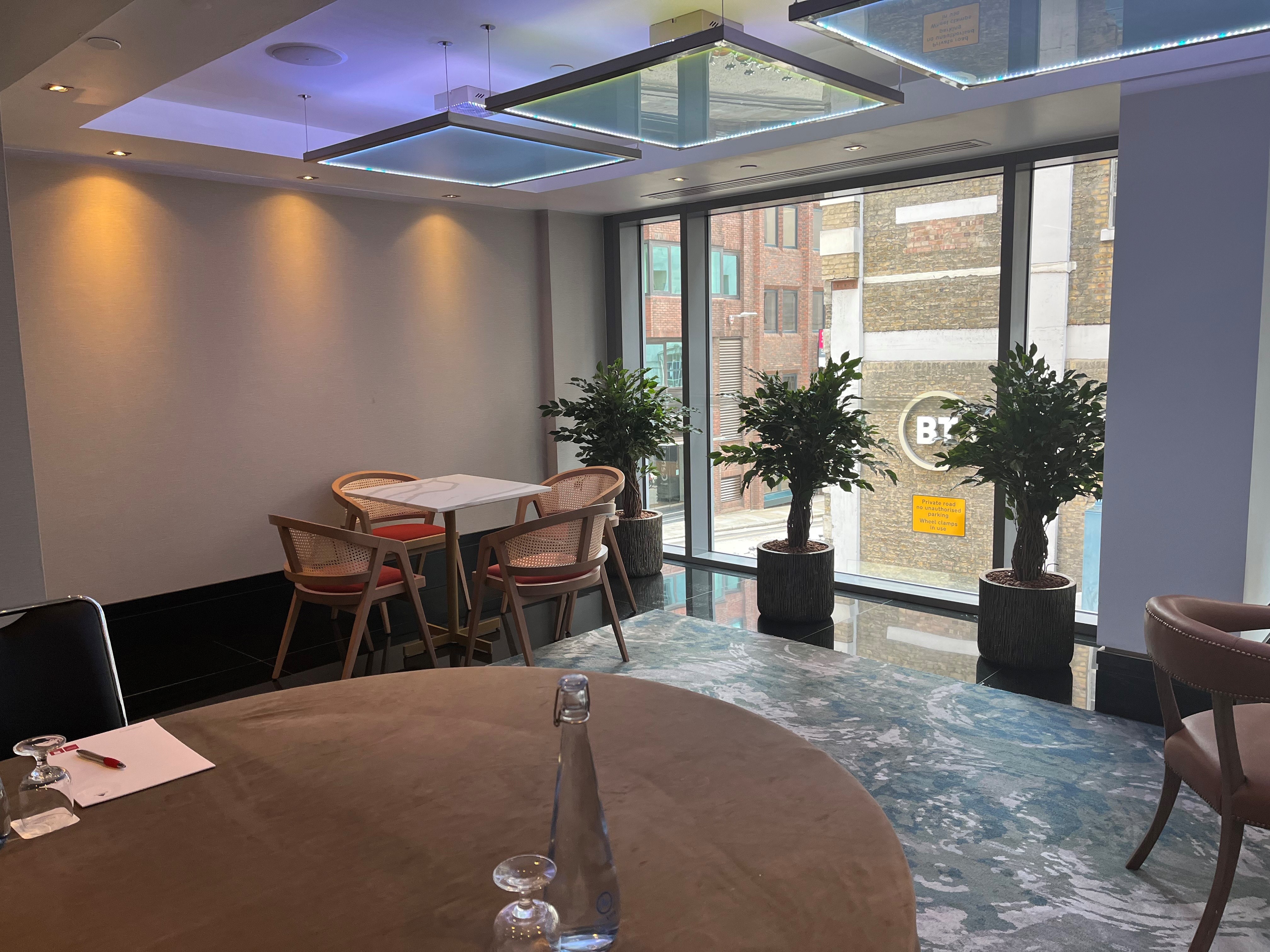 Executive Boardroom at Leonardo Royal Hotel, modern space with large windows for meetings.