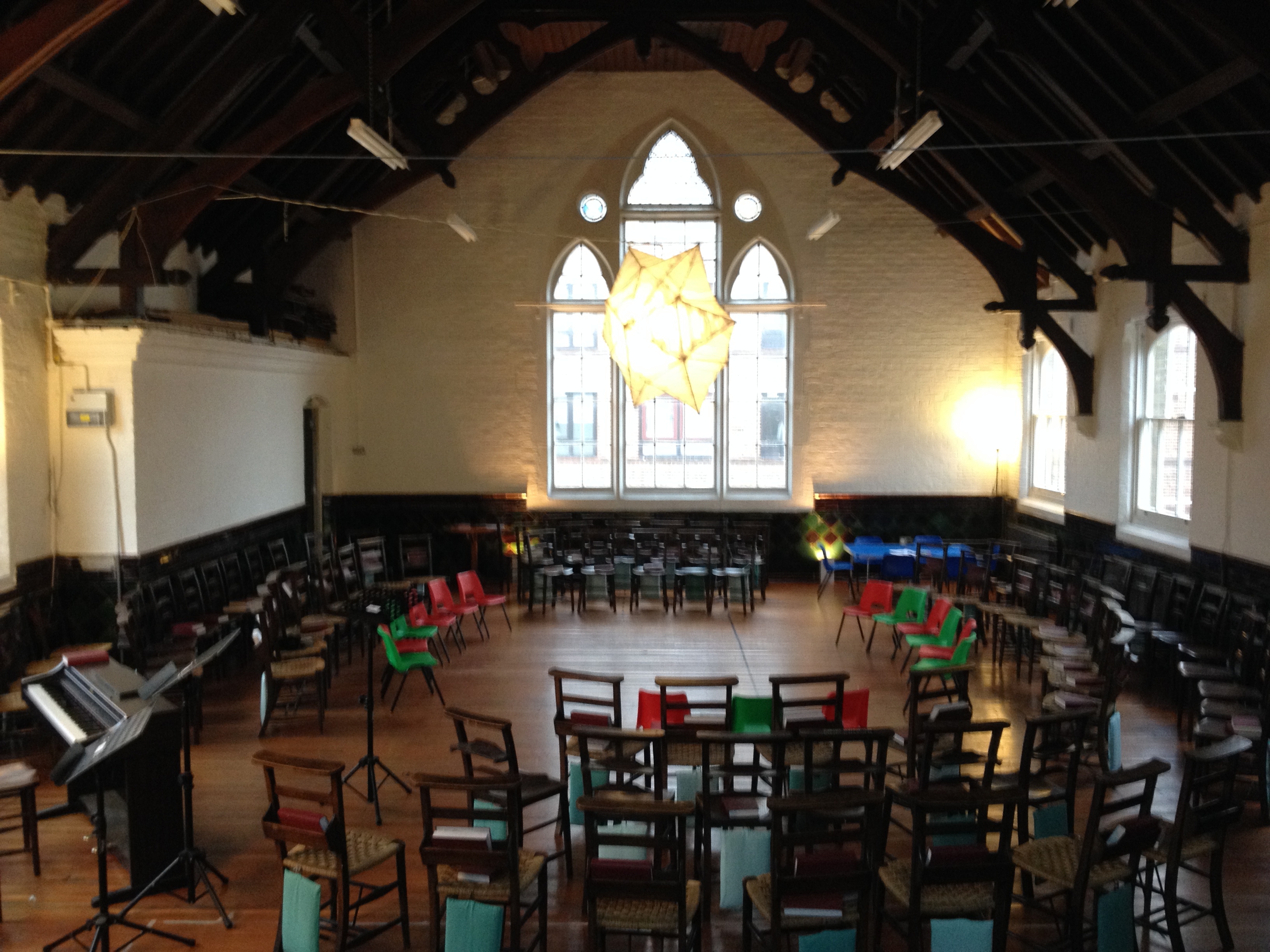 Upper Hall at Saint Barnabas Dalston, colorful chairs for interactive meetings and workshops.