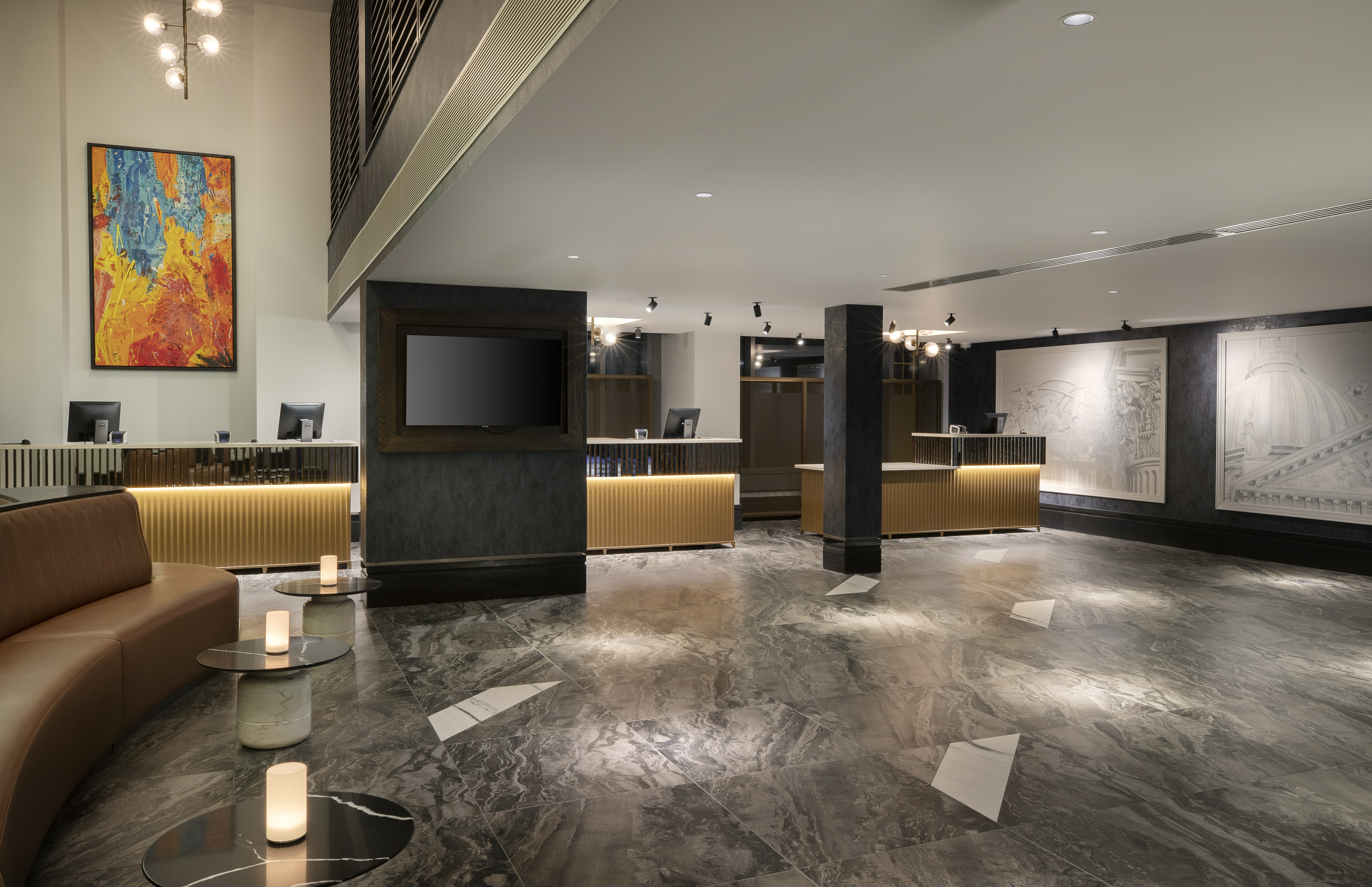 Modern hotel lobby in Dickens Suite, Leonardo Royal Hotel London for events and networking.