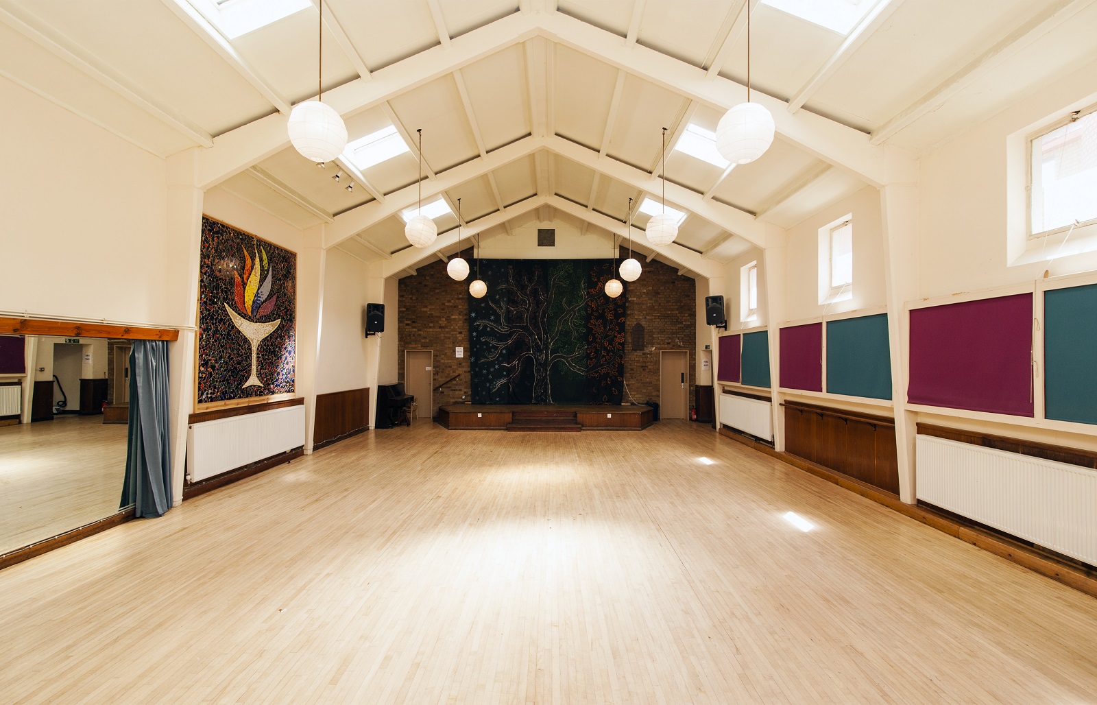Spacious Unity Islington hall with high ceilings, perfect for meetings and workshops.