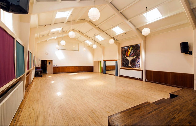 Spacious Large Hall in Unity Islington, ideal for meetings and events with high ceilings.