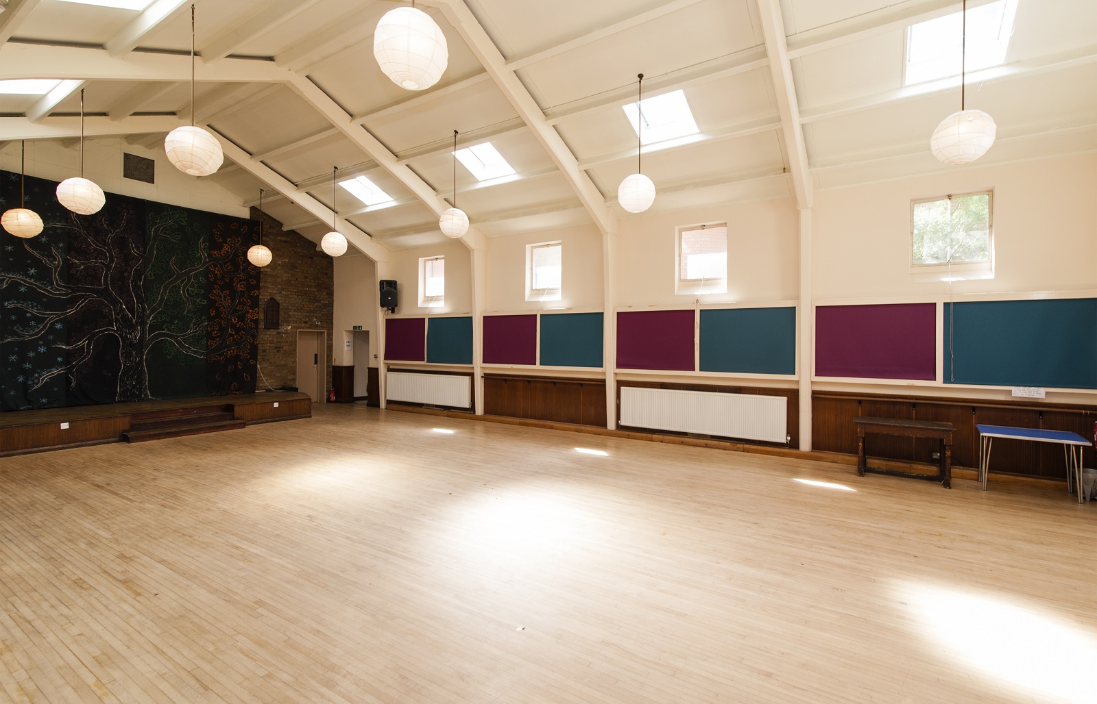 Versatile Large Hall in Unity Islington with vibrant walls for events and workshops.