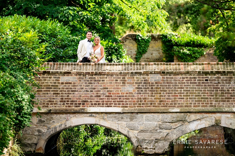 Couple on stone bridge at Tudor Barn Eltham, perfect for weddings and events.