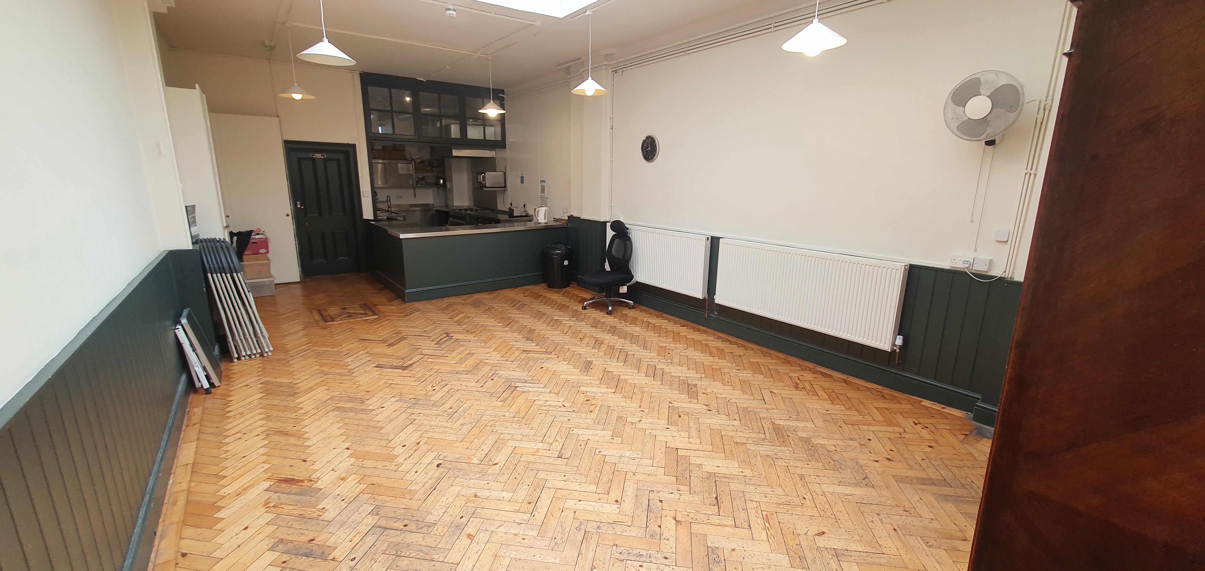 Versatile Small Hall in Unity Islington with hardwood floors for meetings and events.