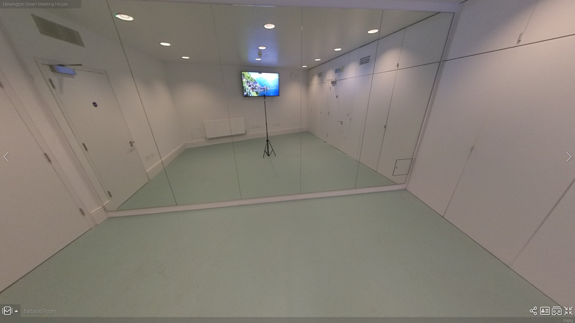 Barbauld Room at Newington Green Meeting House, featuring mirrored walls for events and workshops.