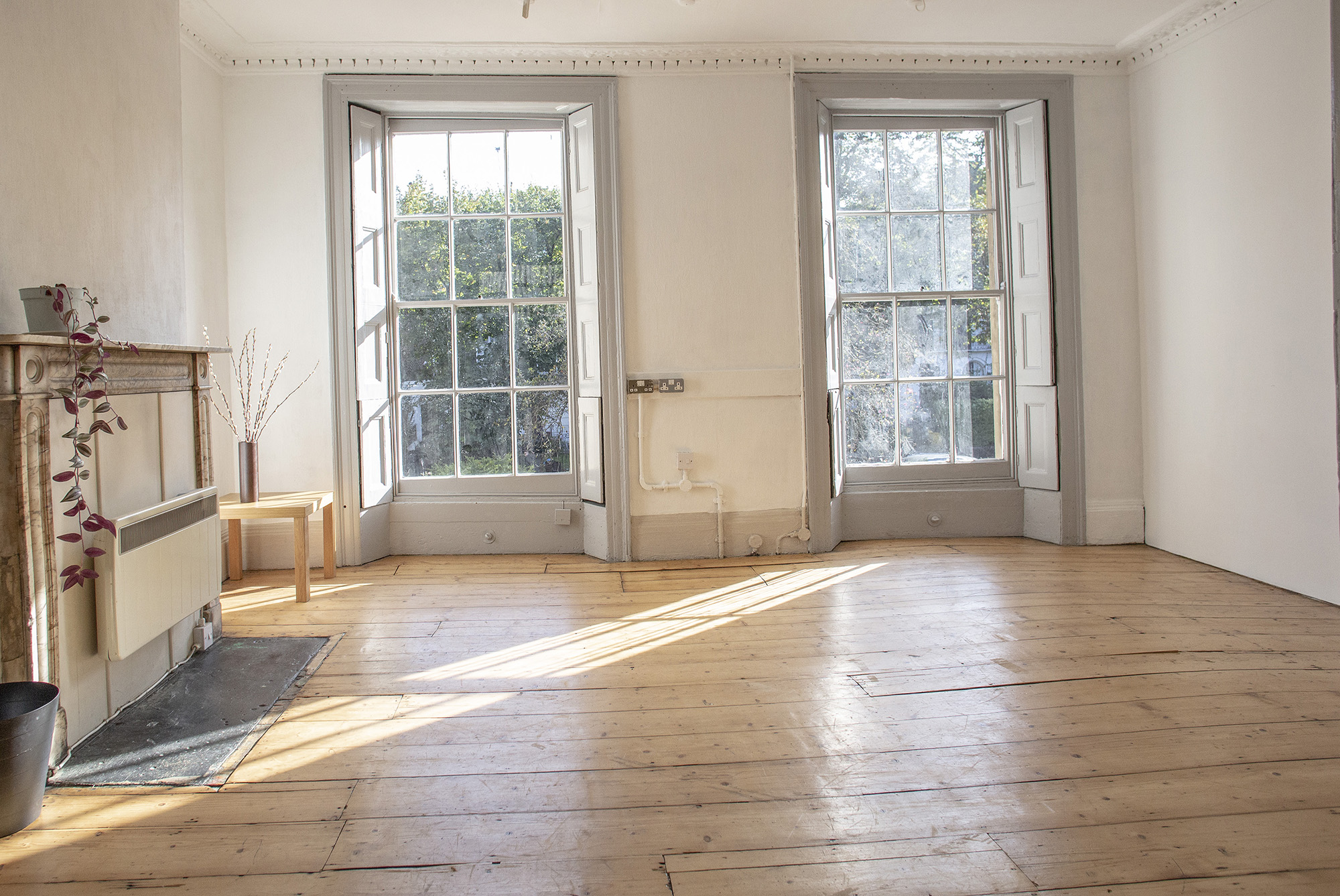 Bright, airy venue with large windows for meetings and events in Anomalous Space.