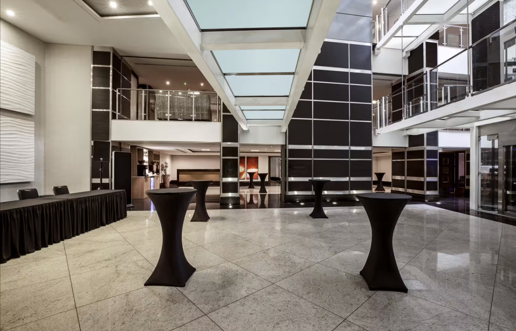 Wren & Shakespeare Suite: modern event space with skylights for networking and receptions.