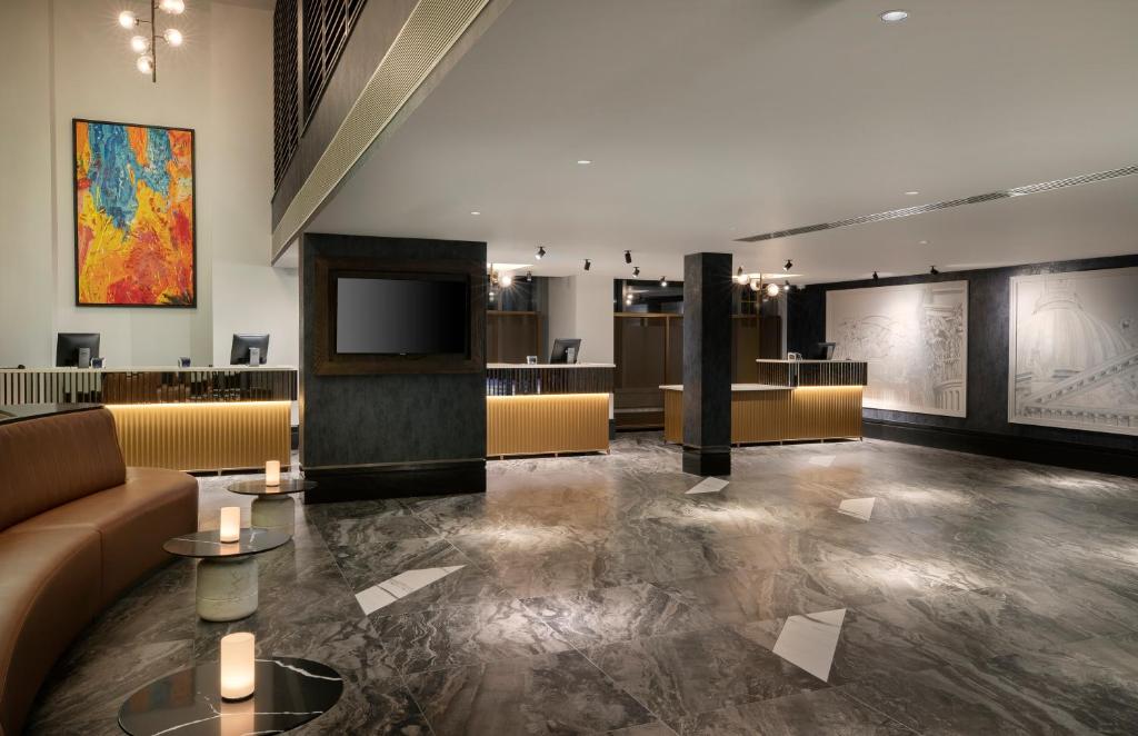 Modern hotel lobby at Leonardo Royal Hotel London St. Pauls, ideal for events and networking.