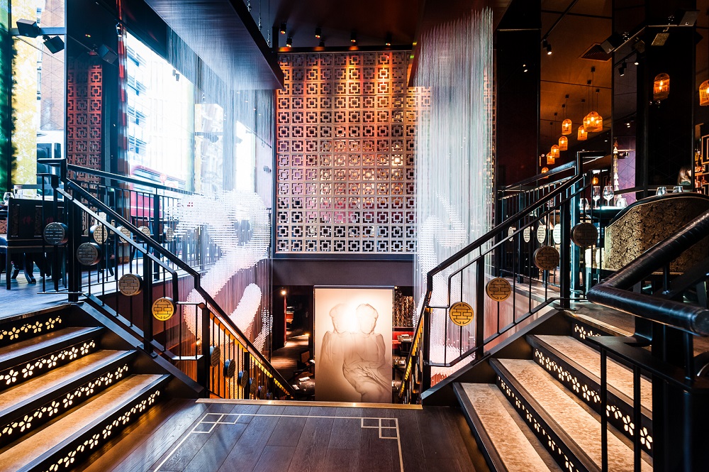 First Floor Bar at Buddha Bar London with inviting staircase, ideal for events and gatherings.