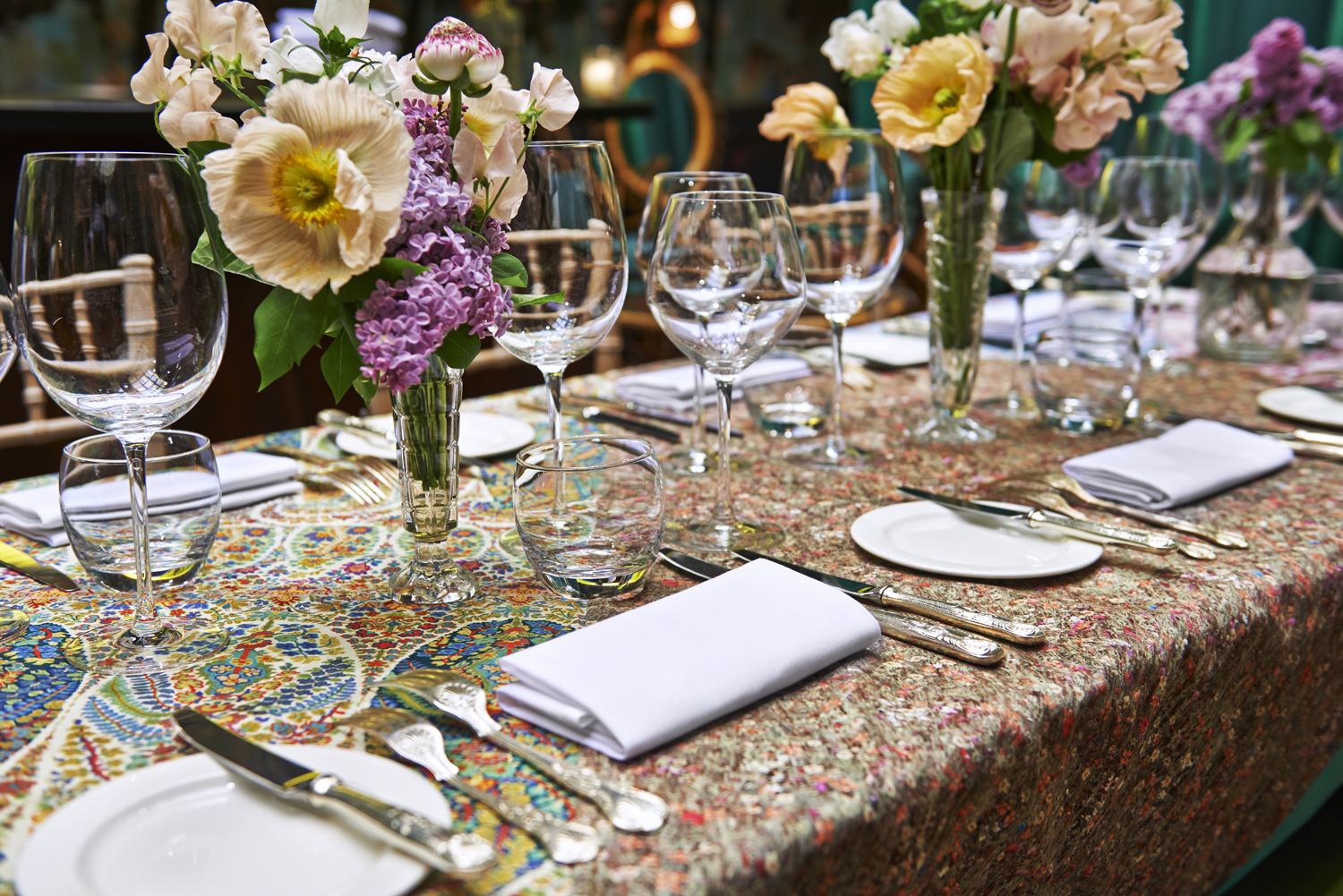 Elegant dining table with floral centerpieces for formal events and gatherings.