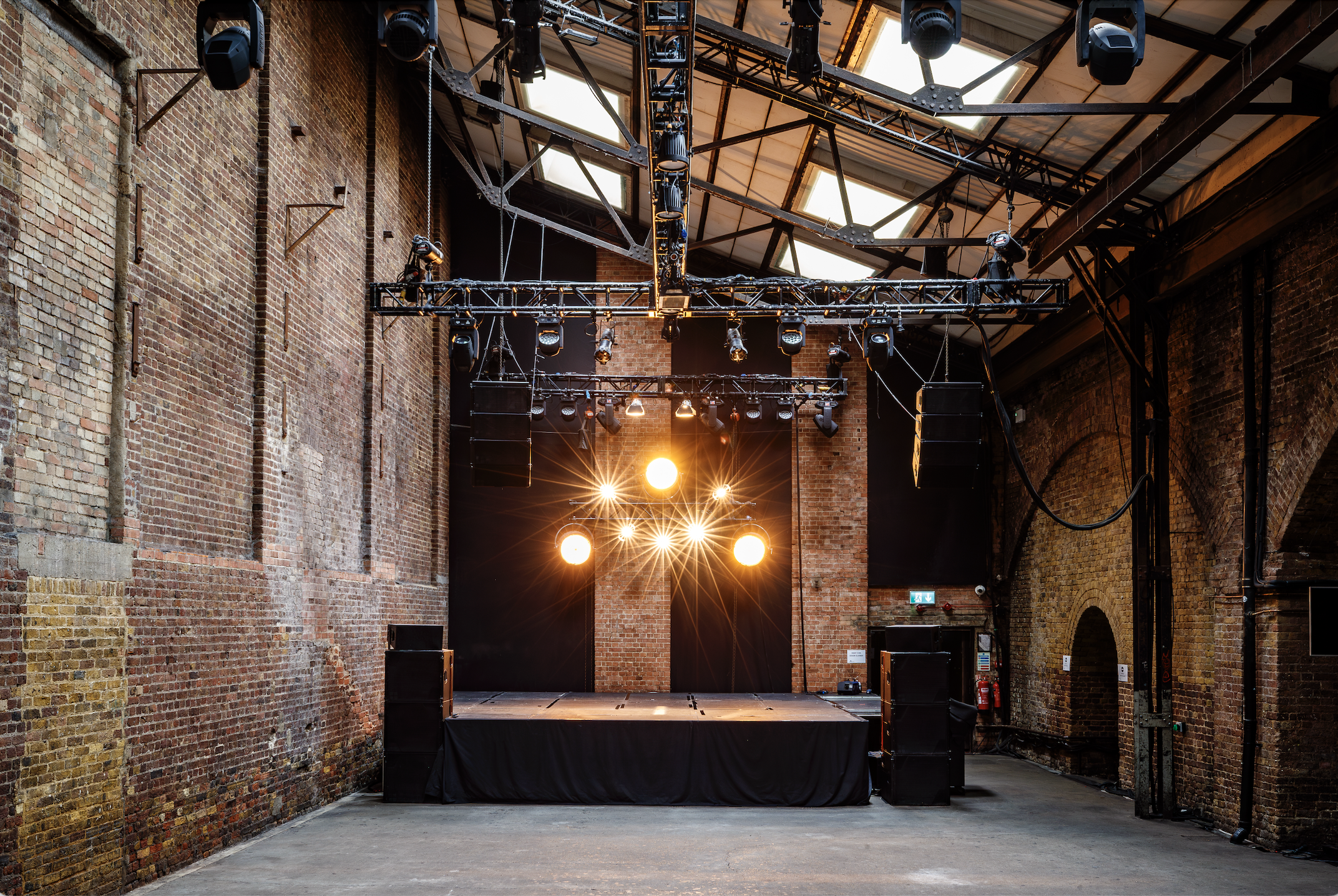 Versatile industrial event space at Village Underground with exposed brick walls.