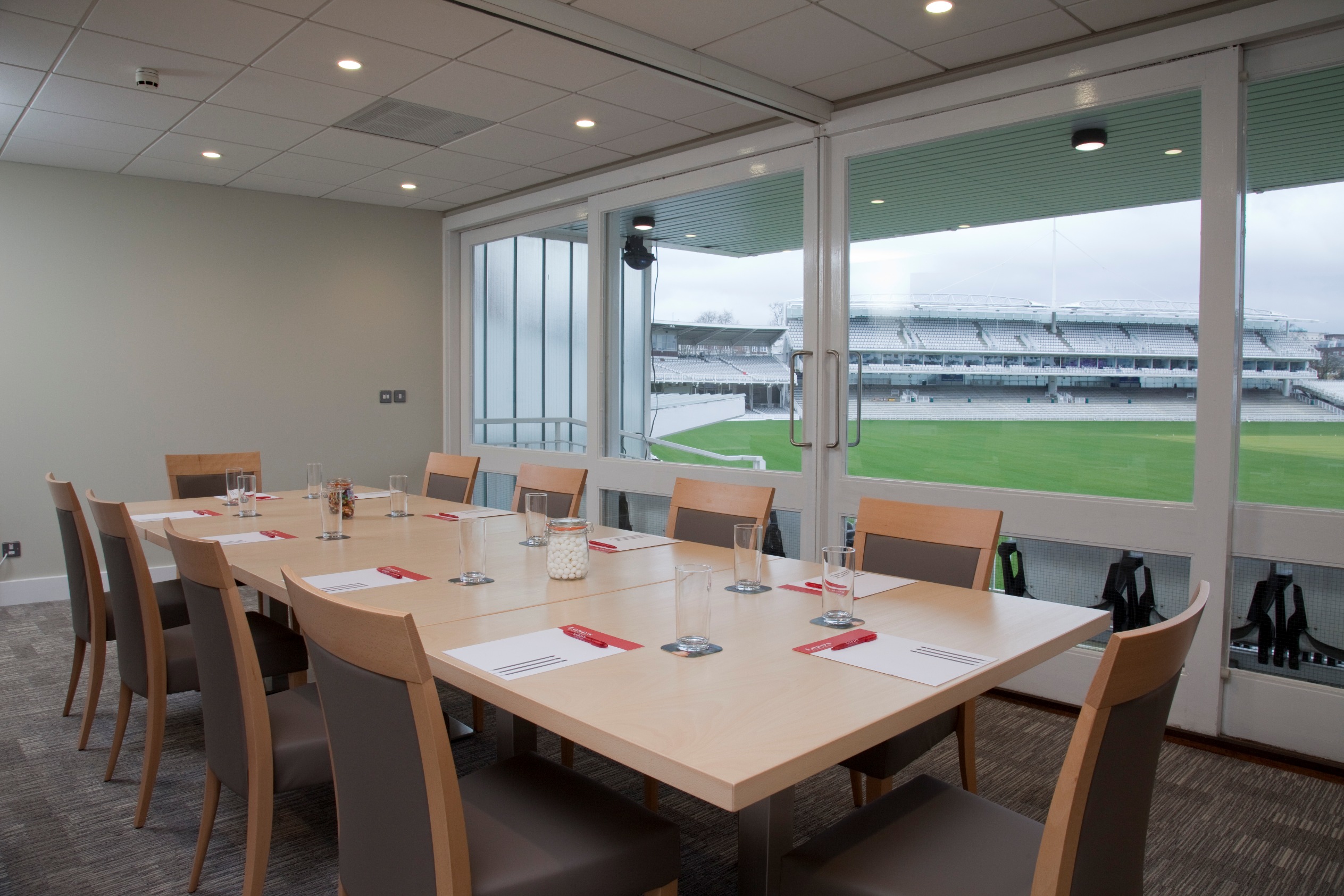 Modern meeting room at Lord's Cricket Ground for corporate events with stadium view.