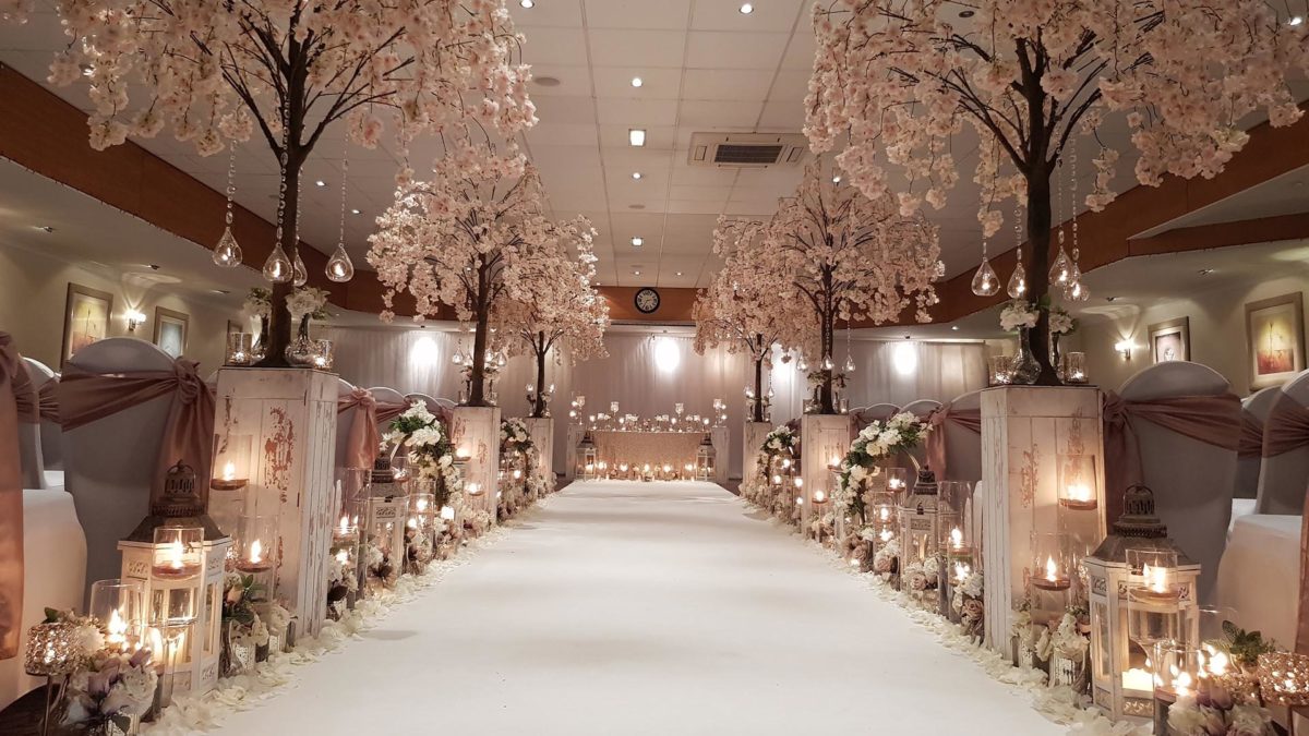 Elegant wedding venue at Cresta Court Hotel with floral arrangements and cherry blossoms.