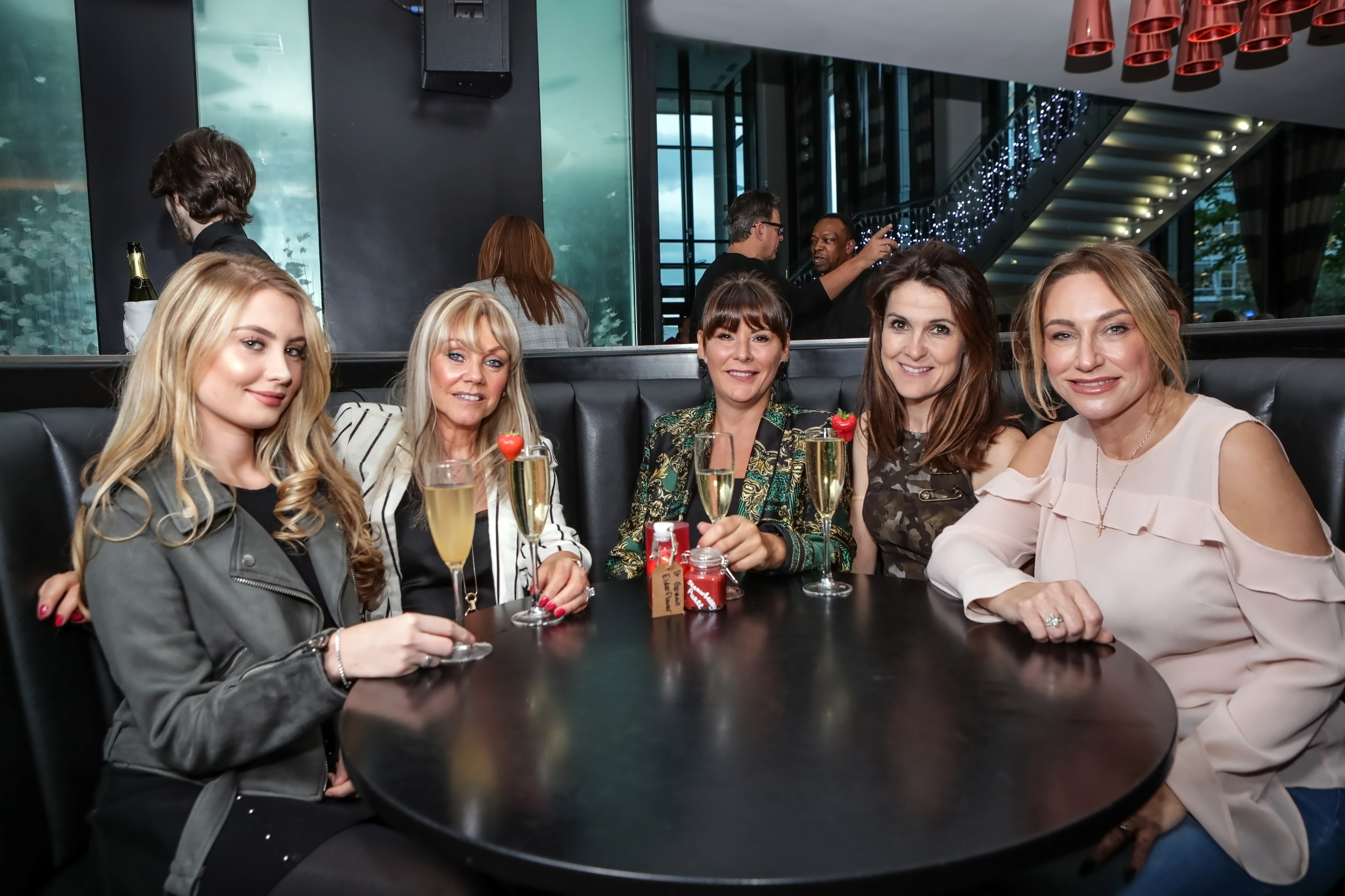 Chic PIMA Bar in Hilton Liverpool: women networking in stylish, inviting atmosphere.