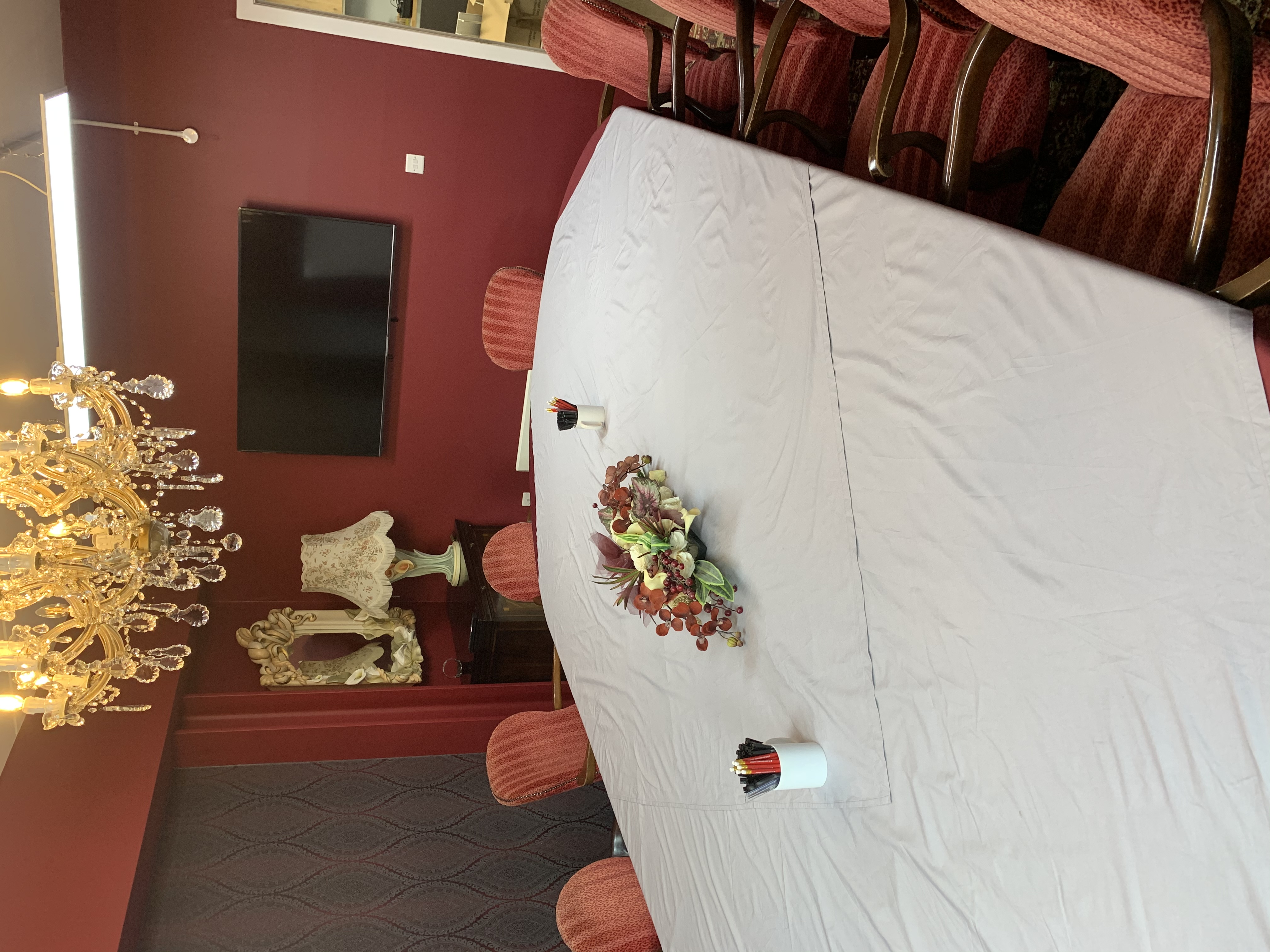 Elegant conference room with oval table, ideal for meetings and events.