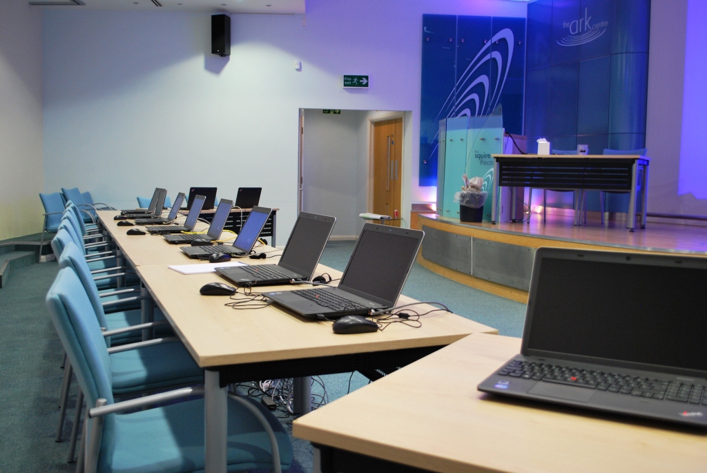 Squire Theatre meeting space with laptops, ideal for workshops and training sessions.