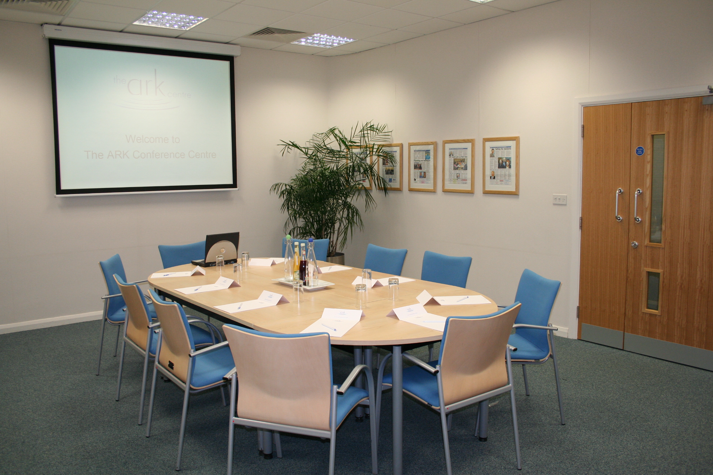 Meeting room at Ark Conference Centre with round table setup for workshops and gatherings.