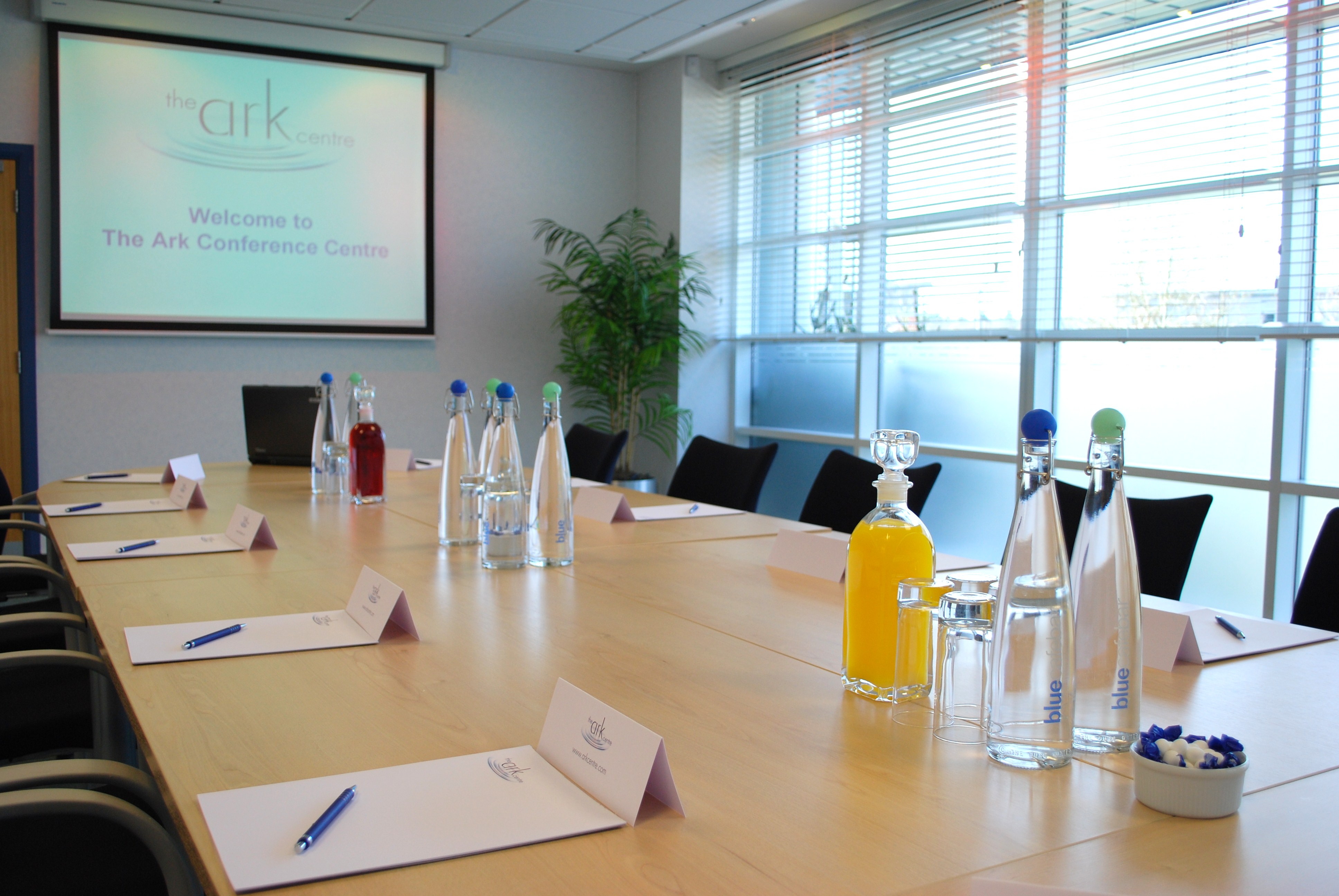 Caspian/Andaman conference room with wooden table, ideal for meetings and events.