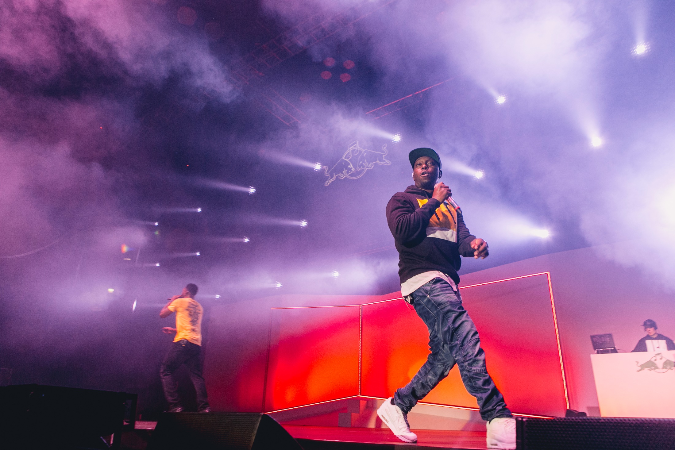 Dynamic live performance at Copper Box Arena with vibrant stage lighting and smoke effects.