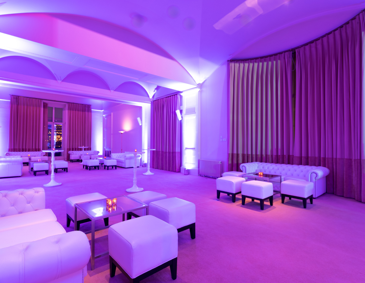 Elegant lounge at Christmas party in Kent House, Knightsbridge with ambient purple lighting.