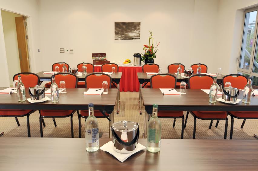 Cinnamon Suite meeting room in AC Hotel Manchester, classroom setup for professional events.