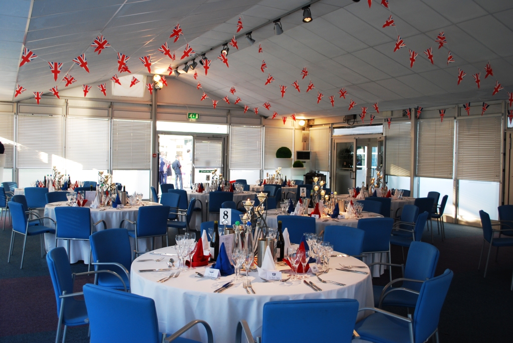 Elegant event space at The Ark Conference Centre with round tables and festive decor.