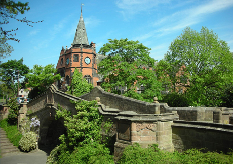 "Leverhulme Hotel Conservatory: historic venue with spire for weddings and corporate events."