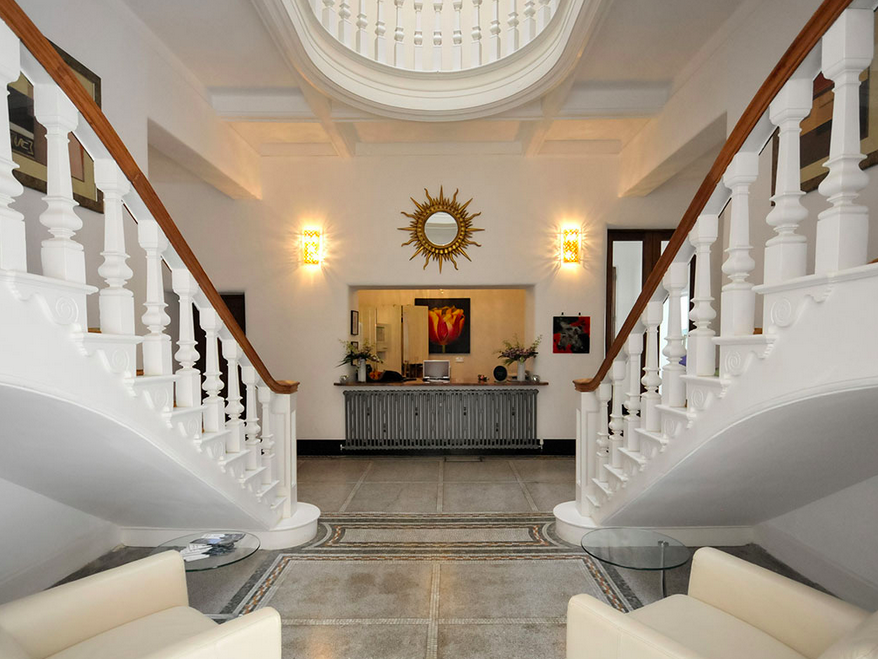 Elegant foyer with grand staircase at The Space, Leverhulme Hotel for events and meetings.