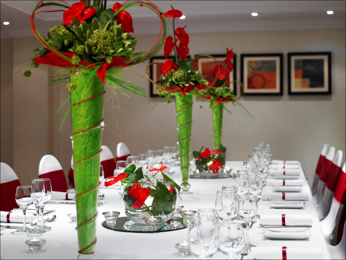 Elegant banquet table with floral centerpieces at Leeds Marriott Hotel for formal events.