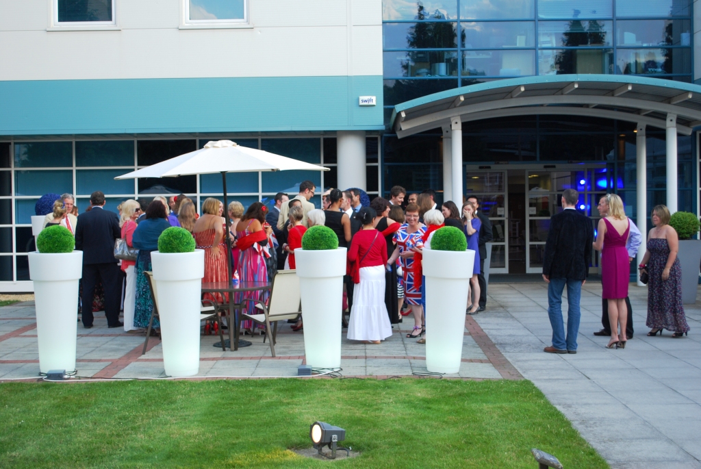 Vibrant outdoor networking event at The Ark Conference Centre with stylish planters.