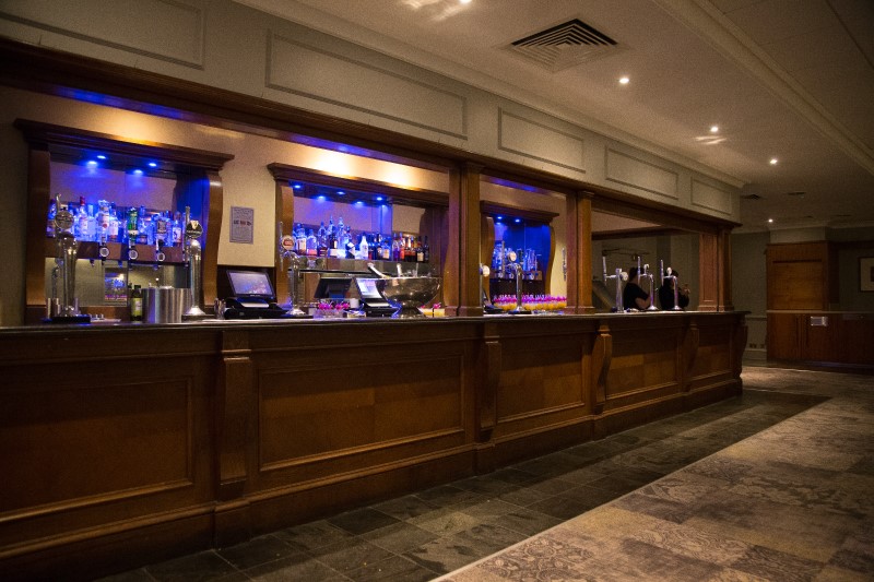 Park Suite bar at St Johns Hotel Birmingham, elegant wooden counter, networking events.