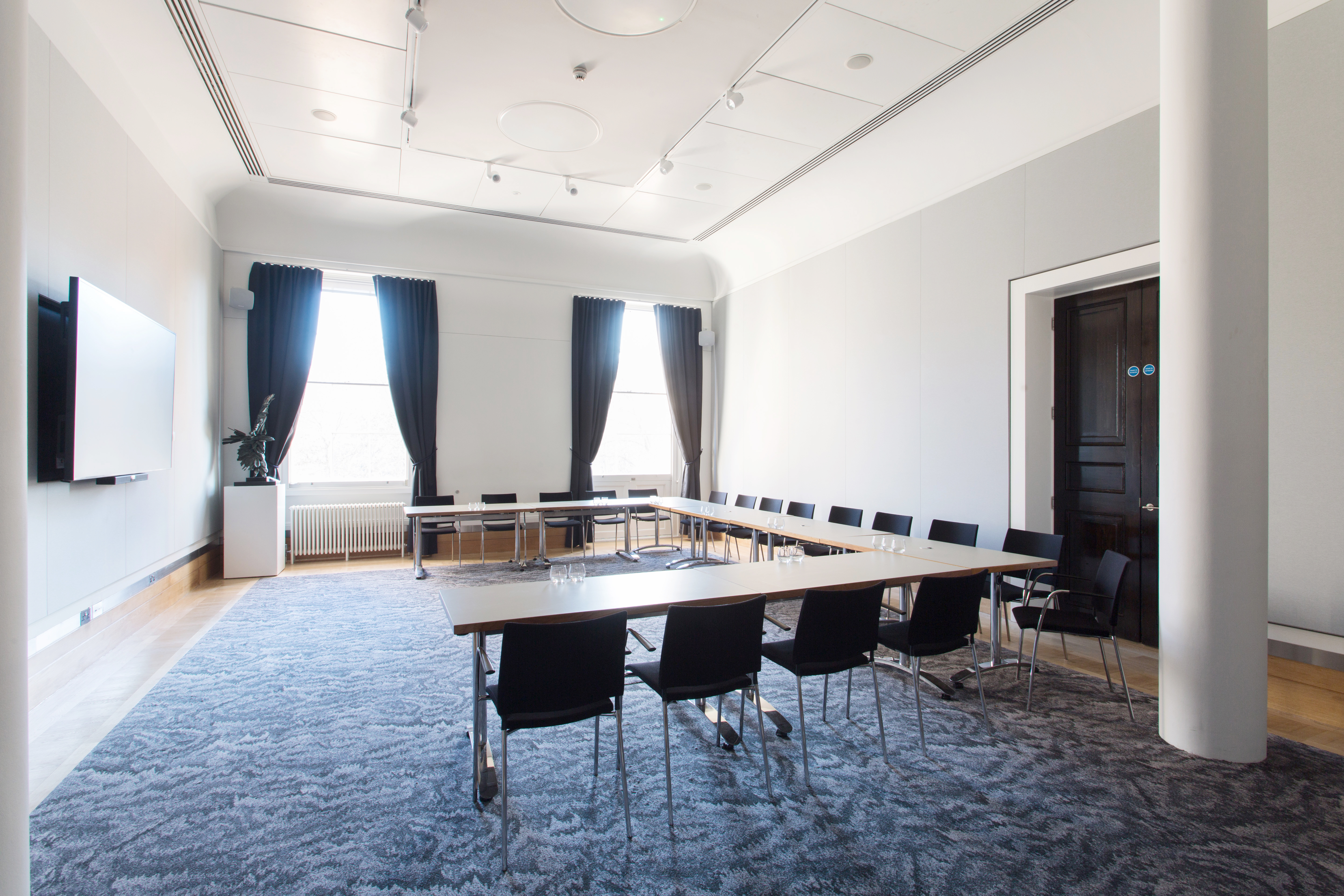 Modern meeting room at National Grid, featuring a long table and natural light for corporate events.