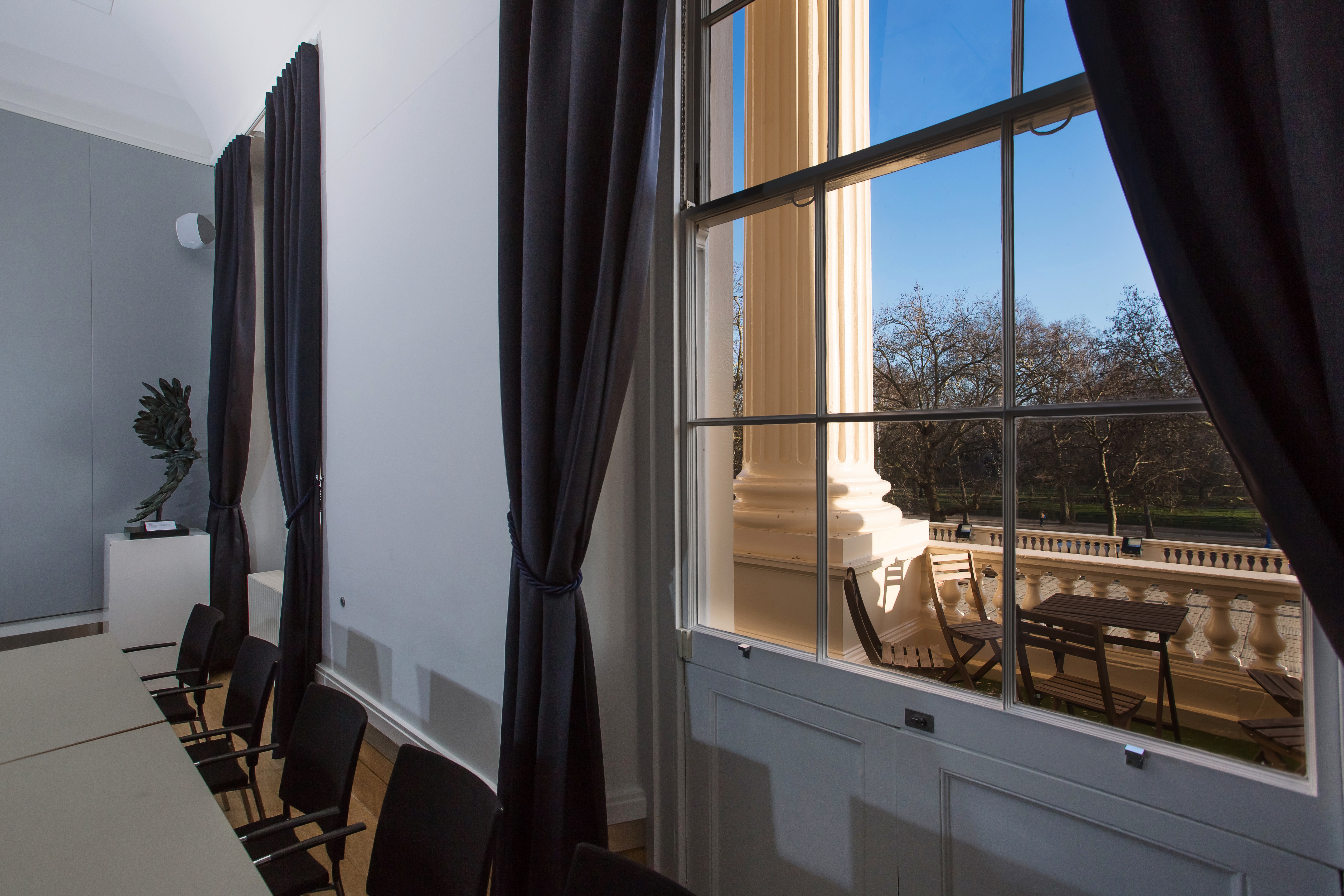 Elegant meeting room at National Grid, featuring large windows for natural light.