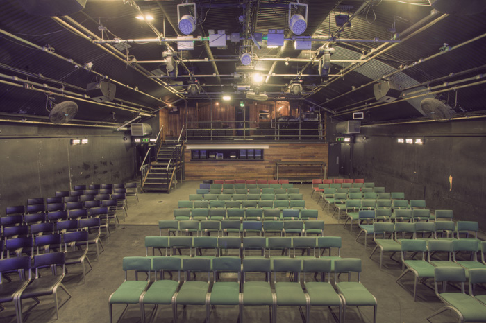 Versatile event space in Gorilla Manchester with tiered seating for presentations and performances.