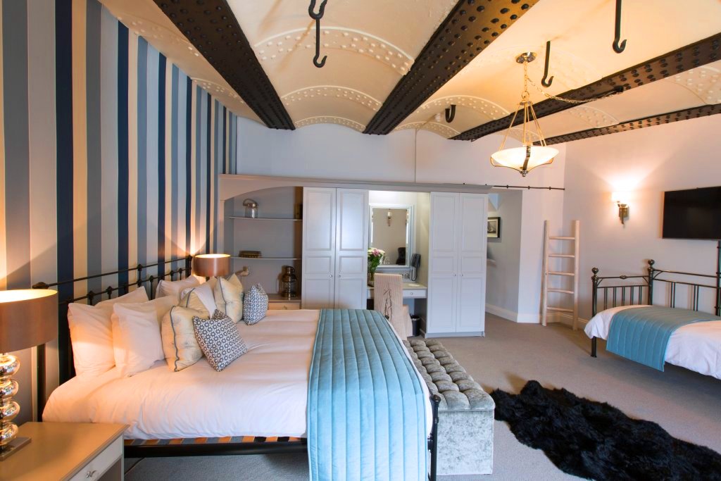 Central Atrium in No Man's Fort, spacious hotel room for VIP events and relaxation.