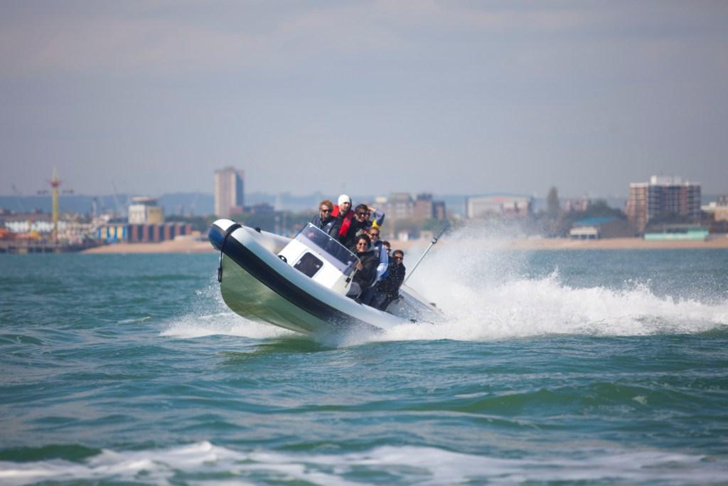 High-energy team-building speedboat activity at No Man's Fort for corporate retreats.