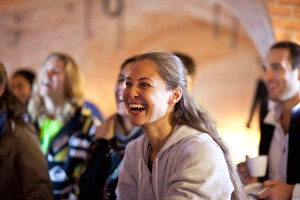 Lively boardroom meeting at No Man's Fort with attendees enjoying a warm atmosphere.