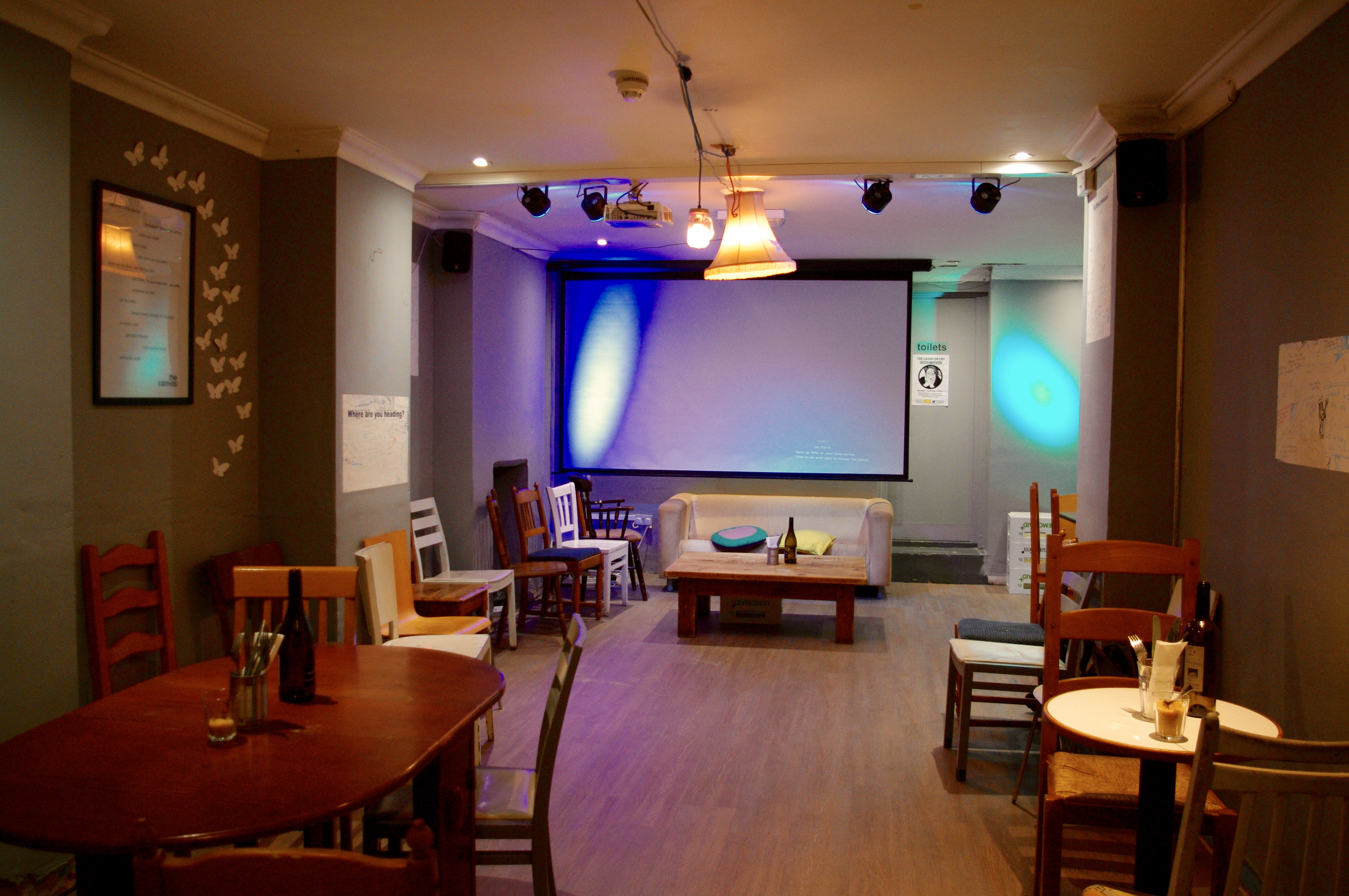 Versatile event space with ambient lighting for intimate gatherings and workshops.