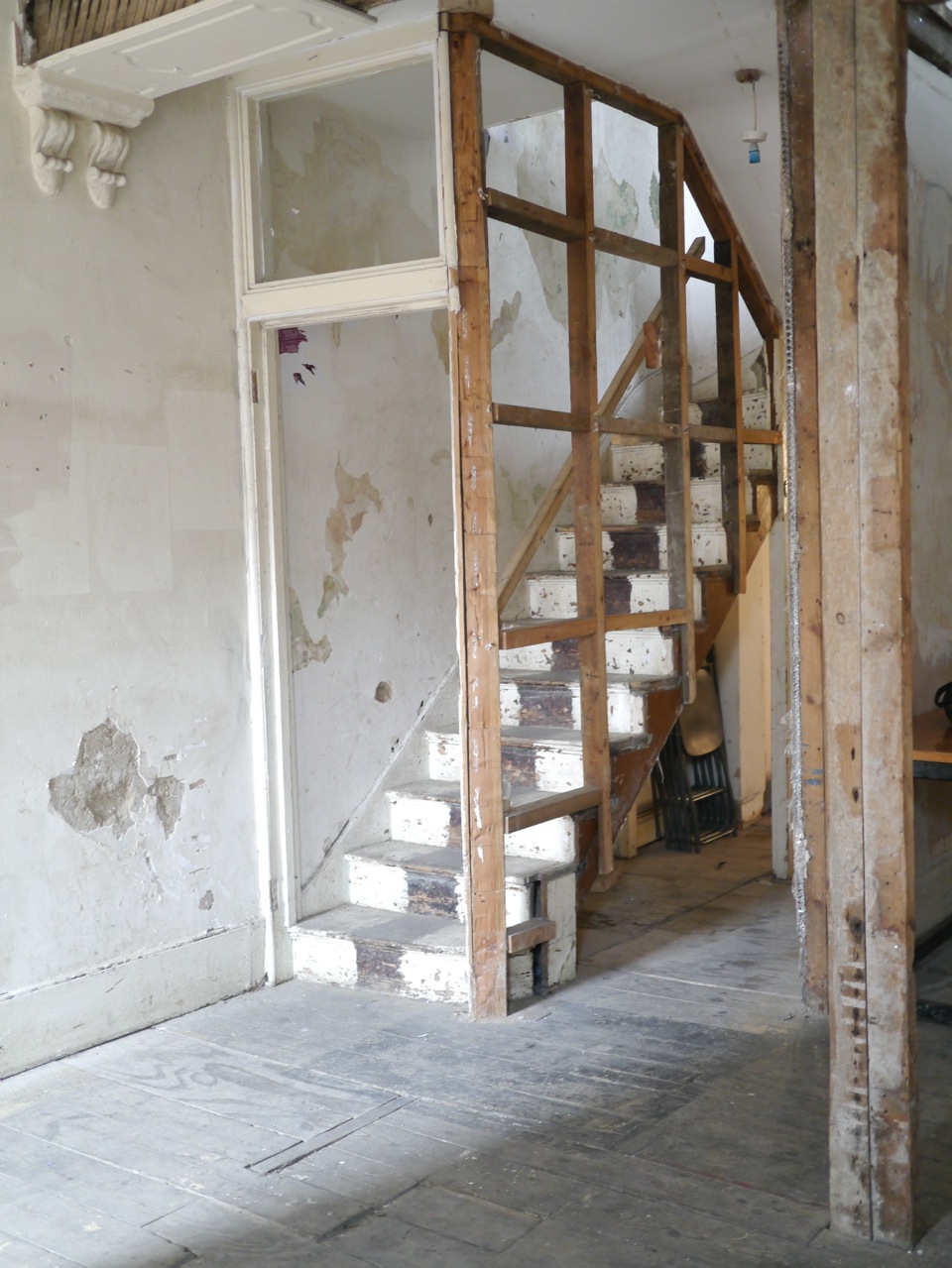 Partially constructed Safehouse 1 with wooden staircase for unique rustic events.