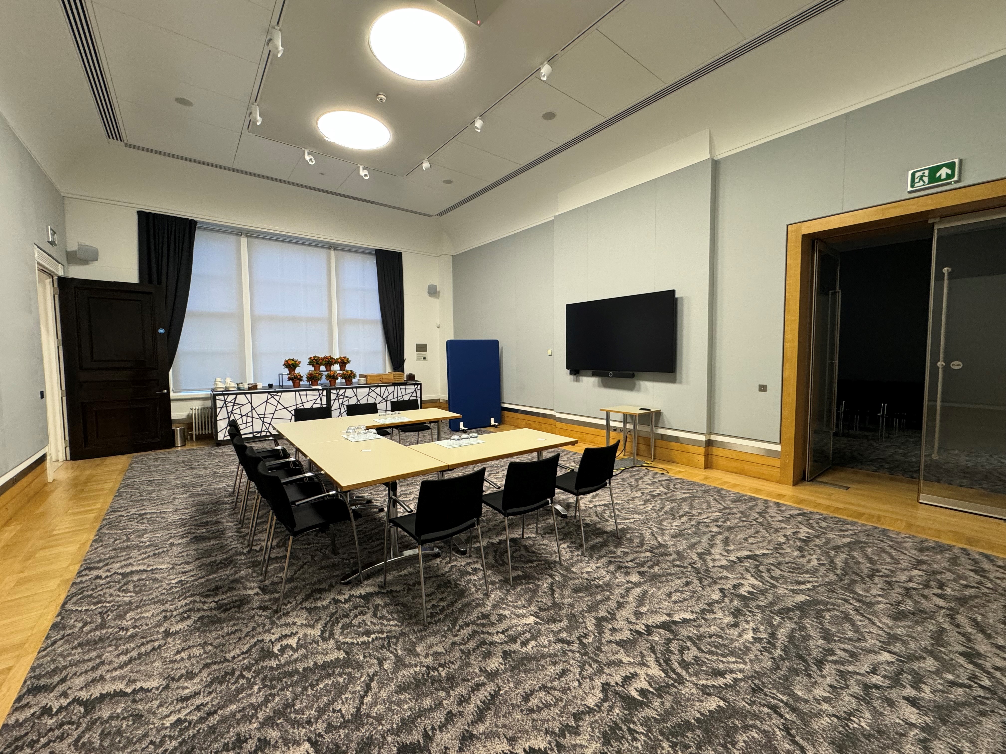 Rolls Royce meeting room with sleek chairs, ideal for professional gatherings and presentations.